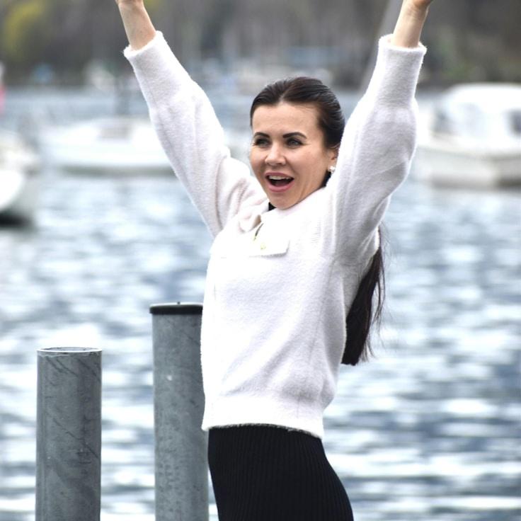Anya Rao, Lead Design Curator at EmberRidgeFlow, reviewing corporate floral arrangements